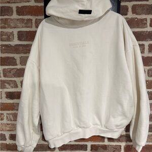 Essentials Cream Pullover Hoodie with Subtle Logo